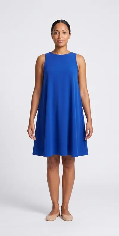AI try-on example: the same woman in a cobalt crepe trapeze dress